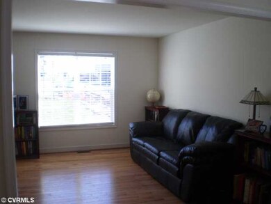Living Room - The wide plank hardwood flooring con