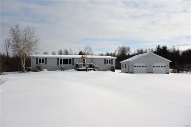 Front of home with 2 stall detached garage
