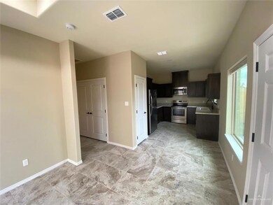 Kitchen featuring light countertops, appliances with stainless steel finishes, and healthy amount of natural light