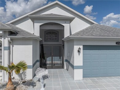 View of exterior entry with a garage