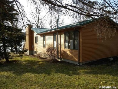 Exterior Back. The cedar siding was recently refin