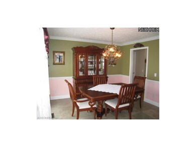 Formal dining room with crown molding and tile flo