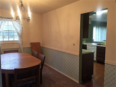 Passage from living room through formal dining roo