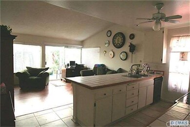 KITCHEN LOOKING TO FAMILY ROOM