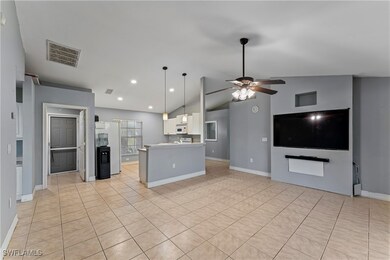 Kitchen with hanging light fixtures, ceiling fan,