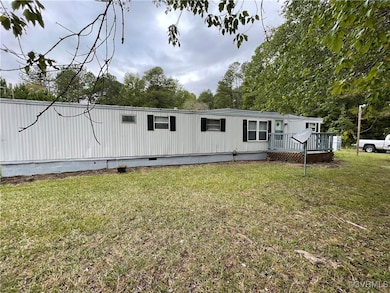 View of front facade with crawl space, a deck, and