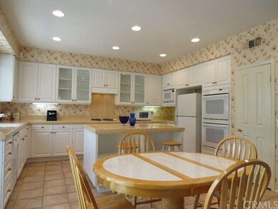 Kitchen again showing microwave, refrigerator, dou