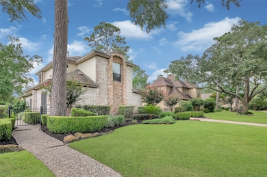 Charming two-story home with a brick exterior, sur
