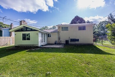 Back of house featuring a patio and a yard