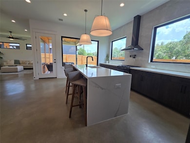 Kitchen with wall chimney exhaust hood, concrete 