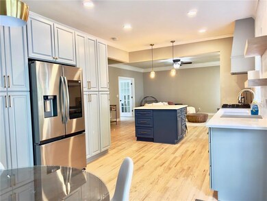 Kitchen with stainless steel fridge with ice dispe