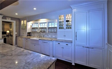Custom Gourmet Kitchen with Extensive Millwork Tri
