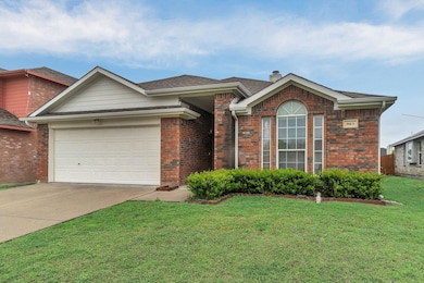 Single story home featuring driveway, a front yard