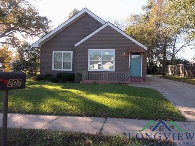 Bungalow-style house with a front lawn