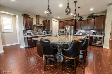 Gourmet kitchen features island, granite, TWO walk