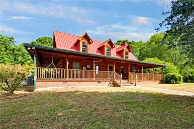 True solid Log home with wrap around porch