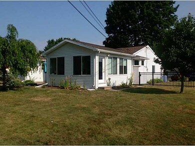 Exterior Back. A view of the family room which was
