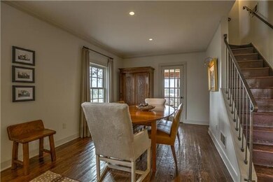 Cozy, formal dining room opens to screened porch.