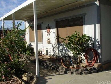 Awning and planters at the front of the home.