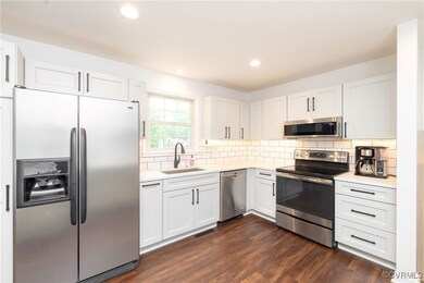 Kitchen with appliances with stainless steel finis