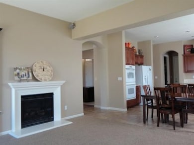 The Greatroom feels warm and inviting as it flows with this marvelous kitchen. Fireplace, Built-in entertainment center and sliding door to backyard make this an inviting gathering place for friends and family.