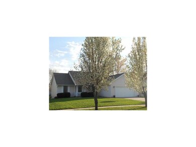 Front Exterior. Trees in bloom line the street add