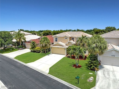 View of front of property with driveway, a garage,