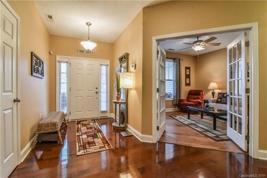 Welcoming foyer and entrance to the den - which co