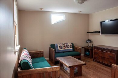 LIVING ROOM AND FAMILY ROOM ARE DIVIDED BY STAIRCA