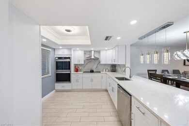 Kitchen with sink, stainless steel appliances, whi