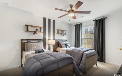 Bedroom featuring carpet flooring and a ceiling fan