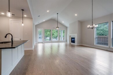 Unfurnished living room featuring a wealth of natu