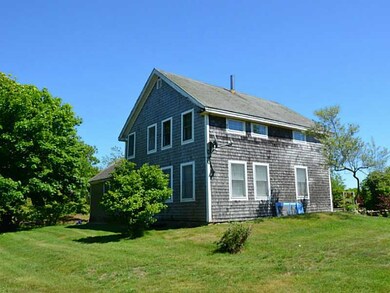 Exterior Front. House & shed need work