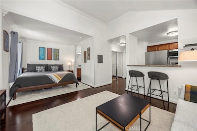 Bedroom alcove and peek a boo view into kitchen area.