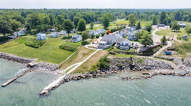 Aerial perspective of suburban area with a nearby body of water