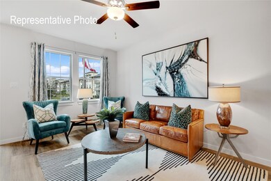 Living room with ceiling fan and light hardwood / wood-style flooring