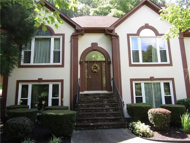 Tudor house featuring stucco siding