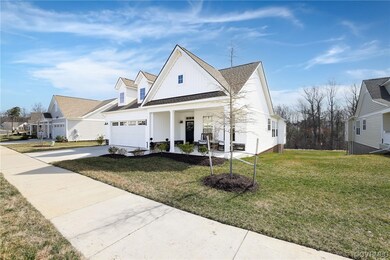 View of front facade with a garage, a front yard,