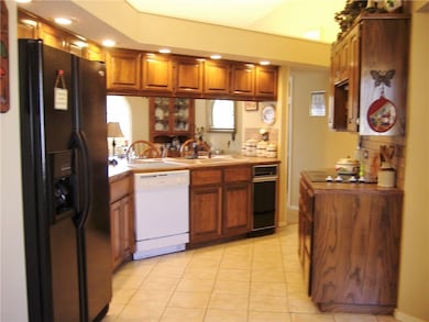 kitchen offers plenty of cabinetry; newer appliances and open concept for entertaining