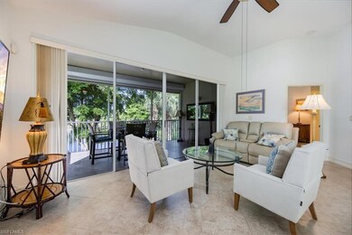Living room featuring lofted ceiling, ceiling fan,