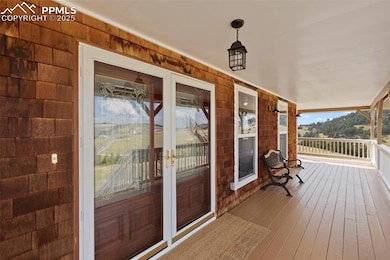 Wrapped in timeless cedar shake siding, the home g