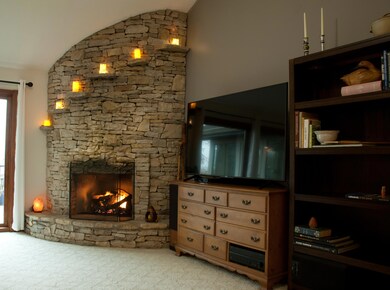 Living Room with Fireplace Lit 1