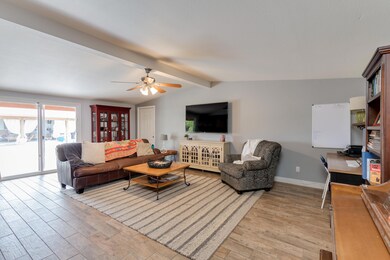 Living room w/ view of the cabana & pool