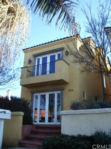 The facade of this distinctive home showing two se