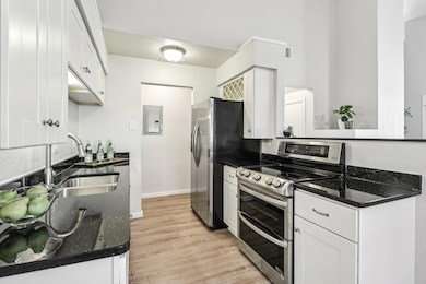Stainless steel appliances and even a wine rack ab