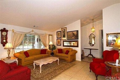 Living room with large windows and vaulted ceiling