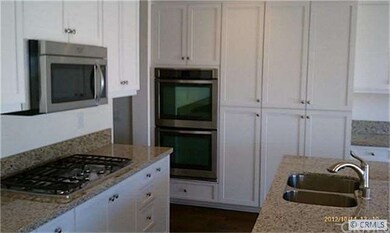 Ample White Cabientry & Granite Counters