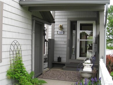 Covered porch entry area.  Door on the left goes t