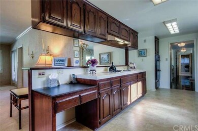 Kitchen is open to formal dining room and family r