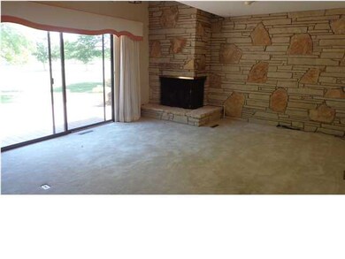 Vaulted ceiling with a stone fireplace